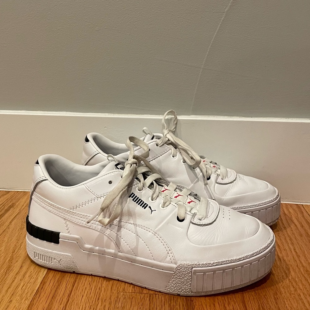 Puma Cali Sport repeat cat sneakers in white and black